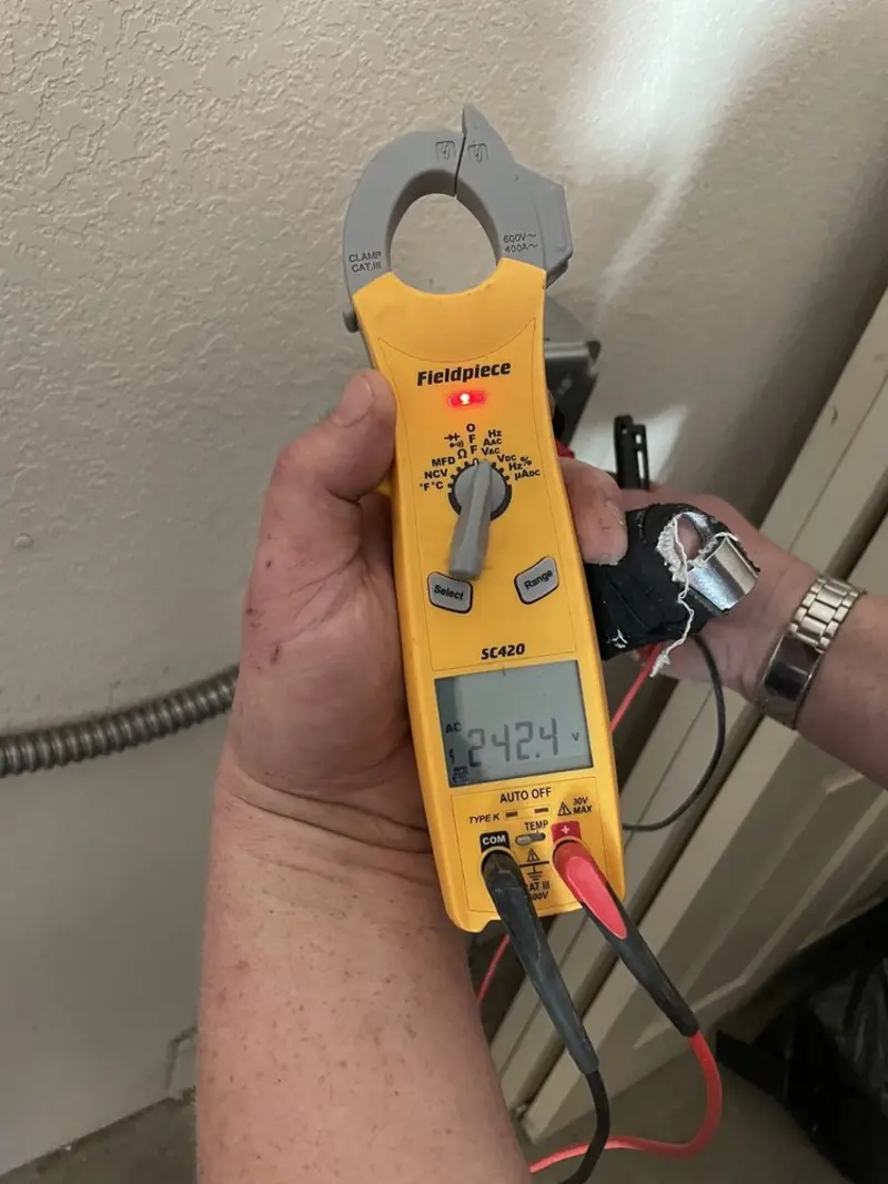Voltage testing with clamp meter during Electrical Installation Services in Great Barrington